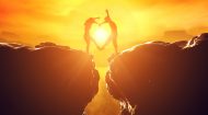 Two people making a love heart symbol