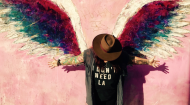 Michele Knight-Waite against wall with wings
